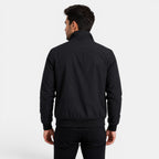 Man wearing a black jacket on a white background