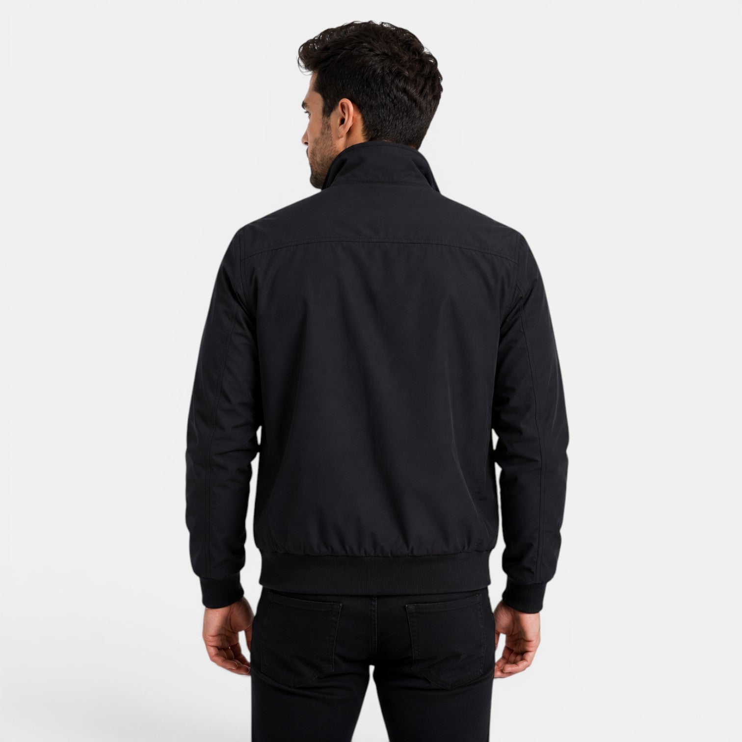 Man wearing a black jacket on a white background