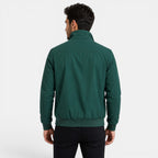 Man wearing a green jacket on a white background