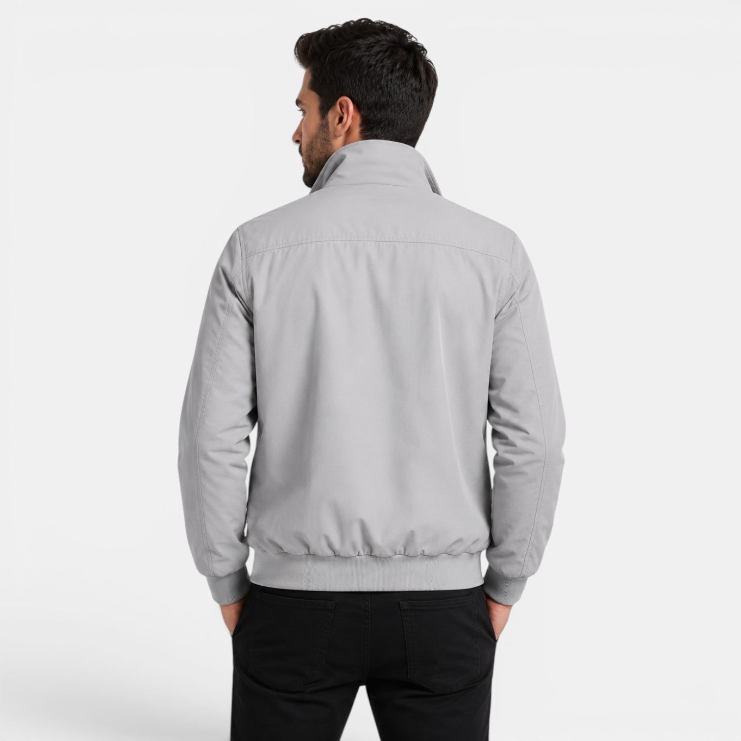 Man wearing a gray jacket on a white background