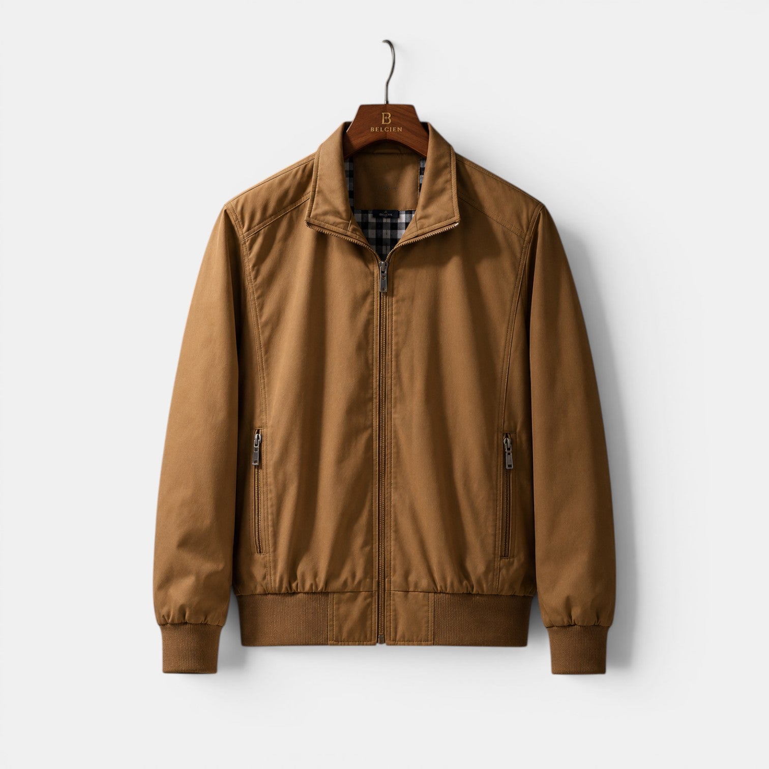 Brown jacket on a hanger against a white background