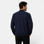 Man wearing a navy blue jacket on a white background