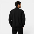 Man wearing a black jacket on a white background
