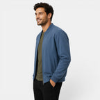 Man wearing a blue jacket on a white background