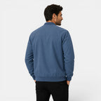 Man wearing a blue jacket on a white background