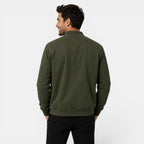 Man wearing a green jacket on a white background