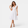 Woman wearing a white dress on a white background