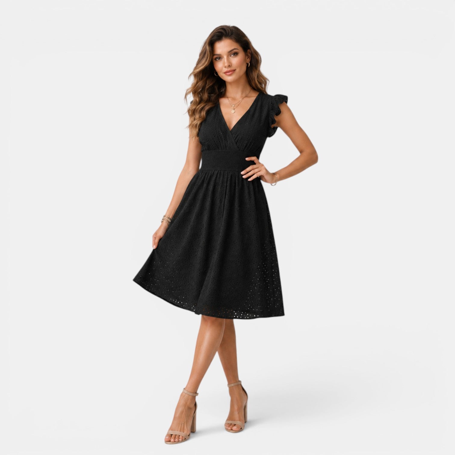 Woman wearing a black dress on a white background