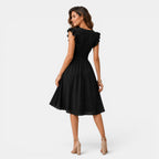 Woman wearing a black dress on a white background