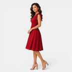 Woman wearing a red dress on a white background