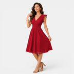 Woman wearing a red dress on a white background