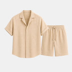 Beige shirt and shorts set on a light gray background
