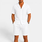 Man wearing a white outfit with a plain background