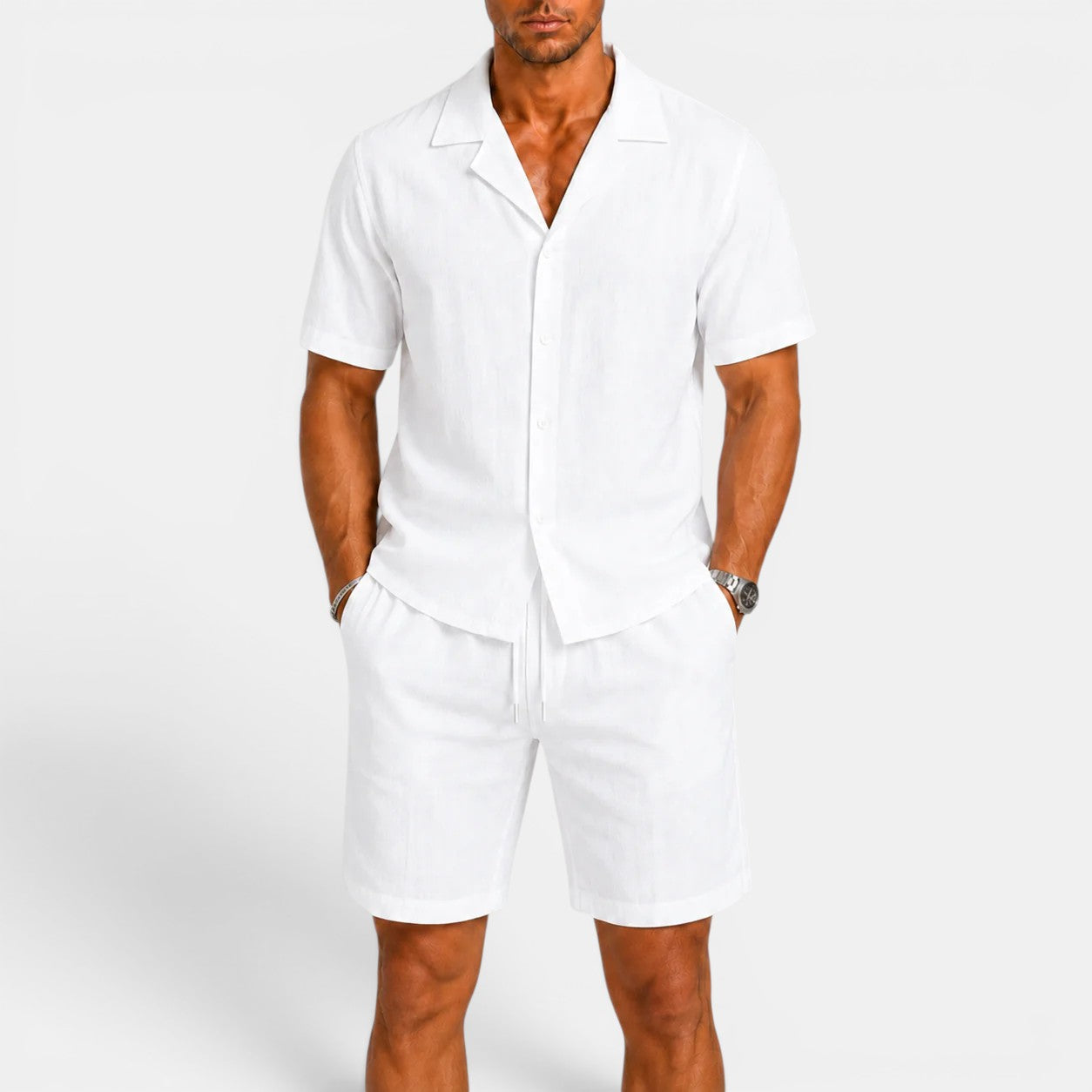 Man wearing a white outfit with a plain background