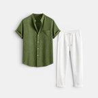 Olive green short-sleeve button-up shirt paired with white drawstring trousers, displayed against a light gray background.