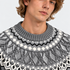 Close-up of men's gray Fair Isle sweater with intricate patterned knit yoke