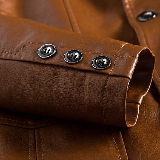 Close-up of a brown leather jacket with buttons