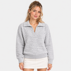 Women's light gray quarter-zip pullover sweater with collared neckline and ribbed cuffs
