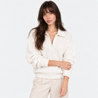 Women's white knit polo sweater with collared neckline and button placket
