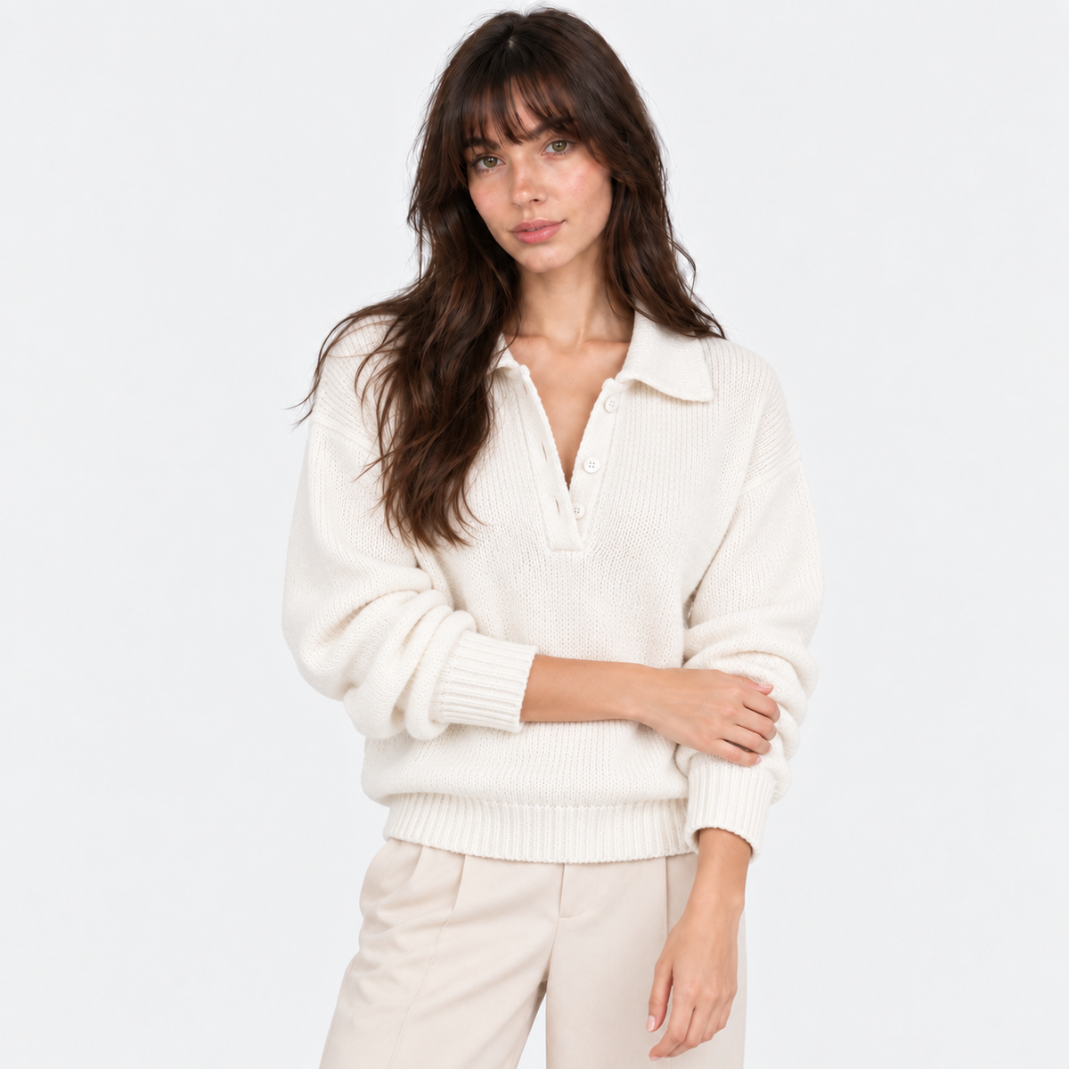 Women's white knit polo sweater with collared neckline and button placket