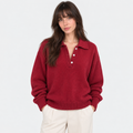 Women's red knit polo sweater with collared neckline, button placket, and long sleeves