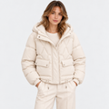 Women's cream quilted puffer jacket with hood, front pockets, and zip closure