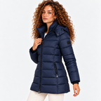 Side view of a woman wearing a navy blue quilted puffer coat with front zipper