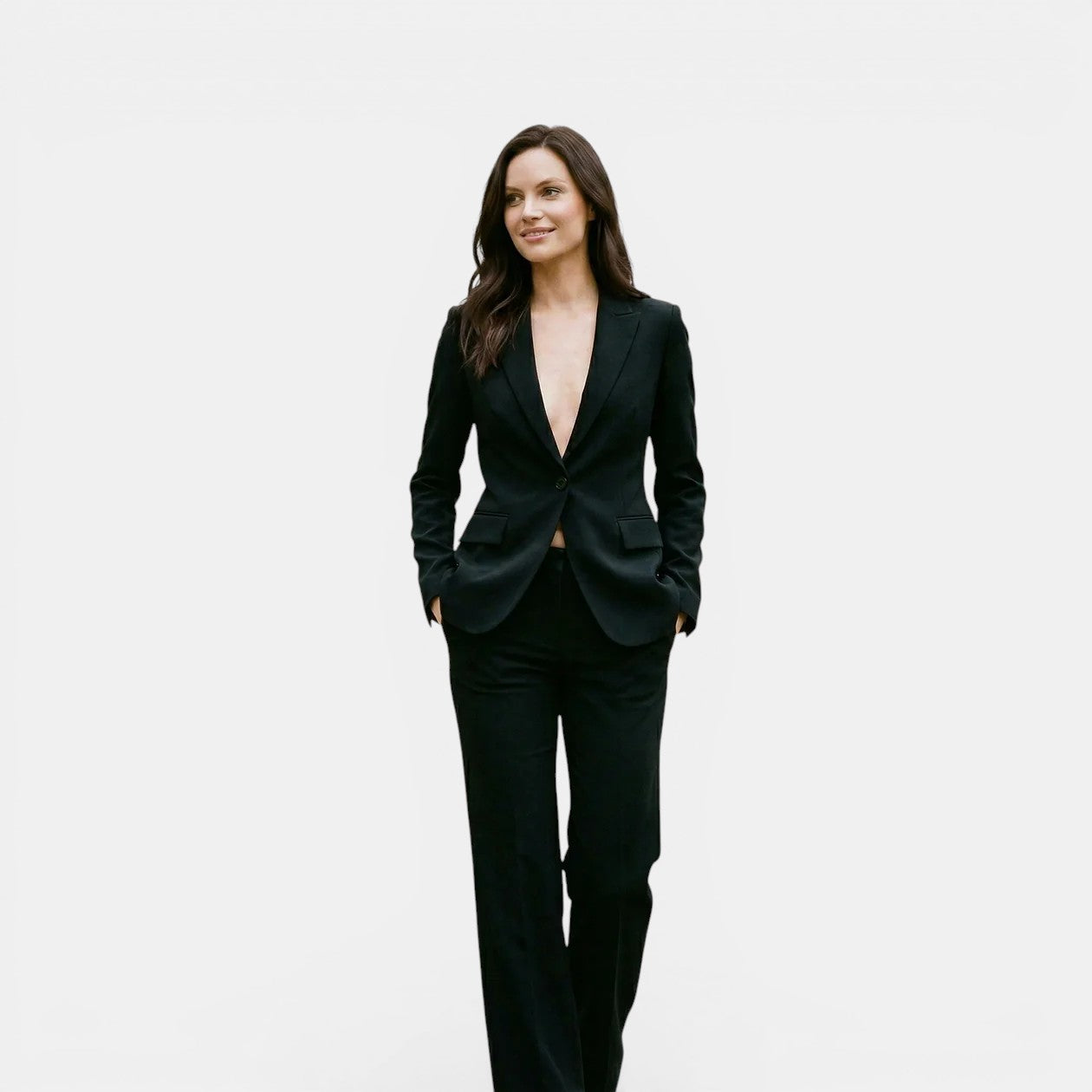 Woman wearing a black suit on a white background