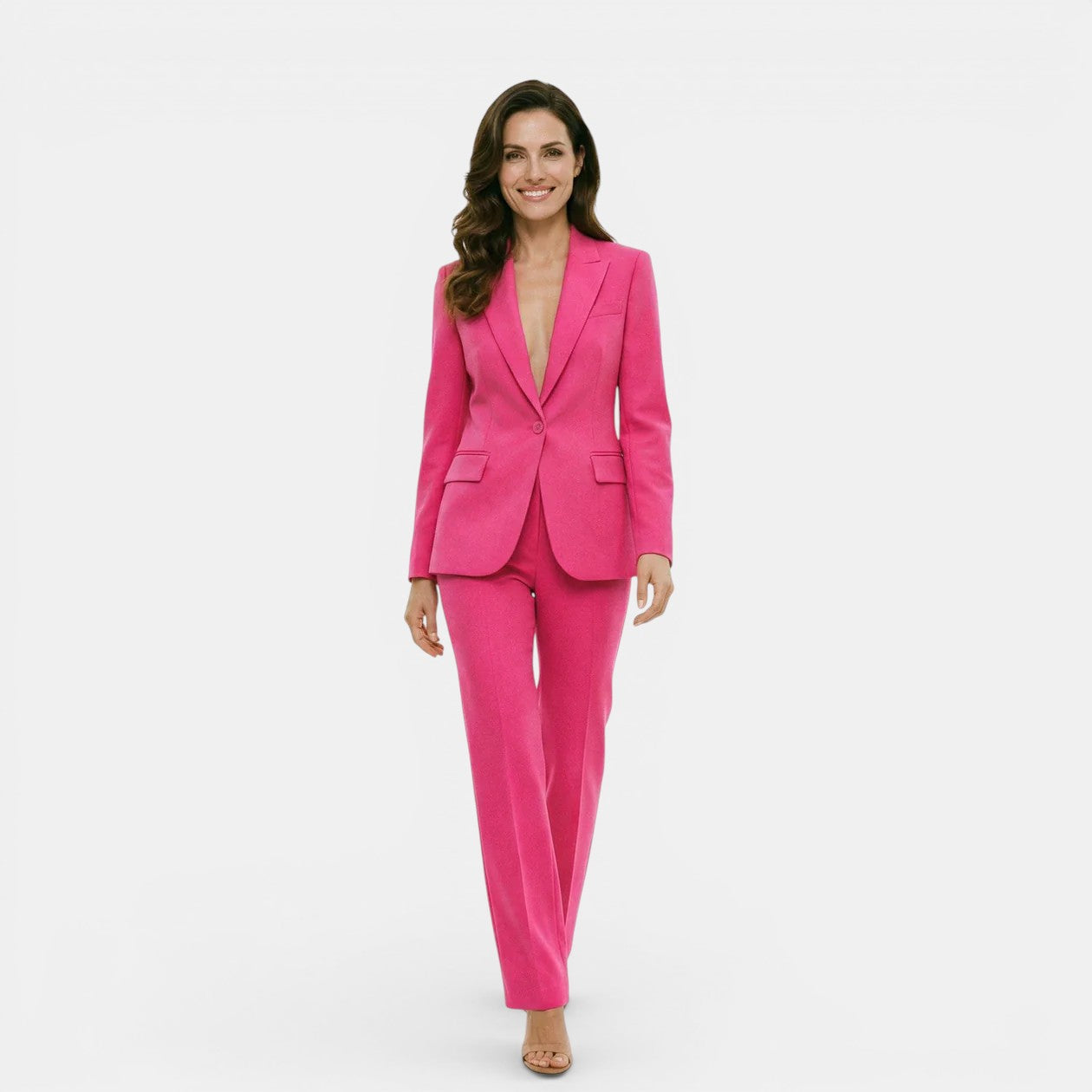 Woman wearing a bright pink suit on a white background