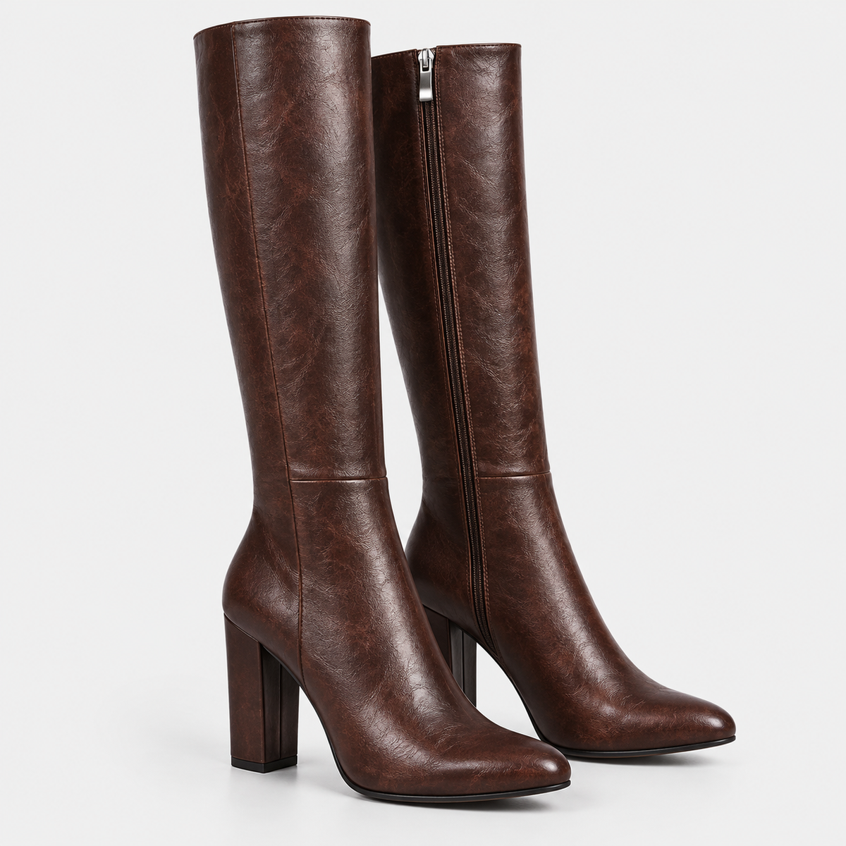 Women's dark brown knee-high boots with side zipper, pointed toes, and block heels