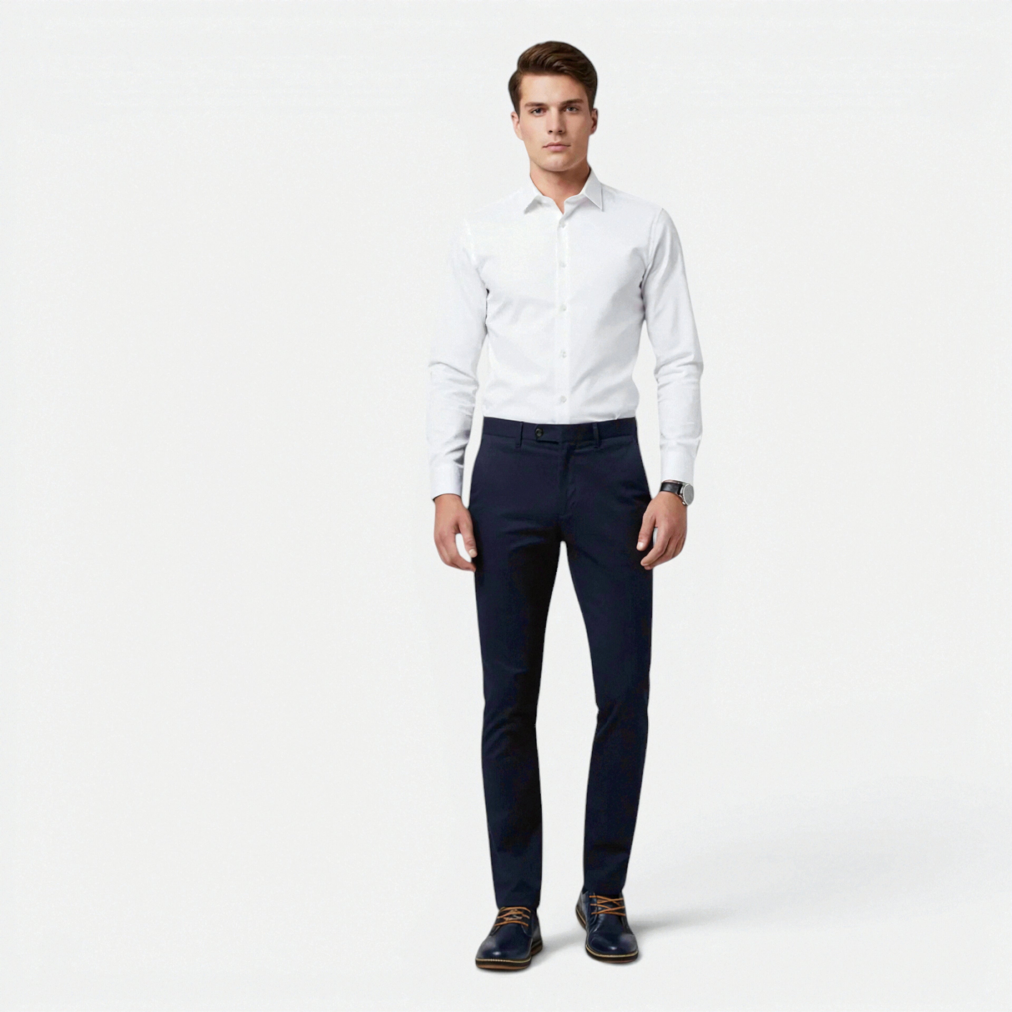 Man wearing a white dress shirt and navy pants on a white background