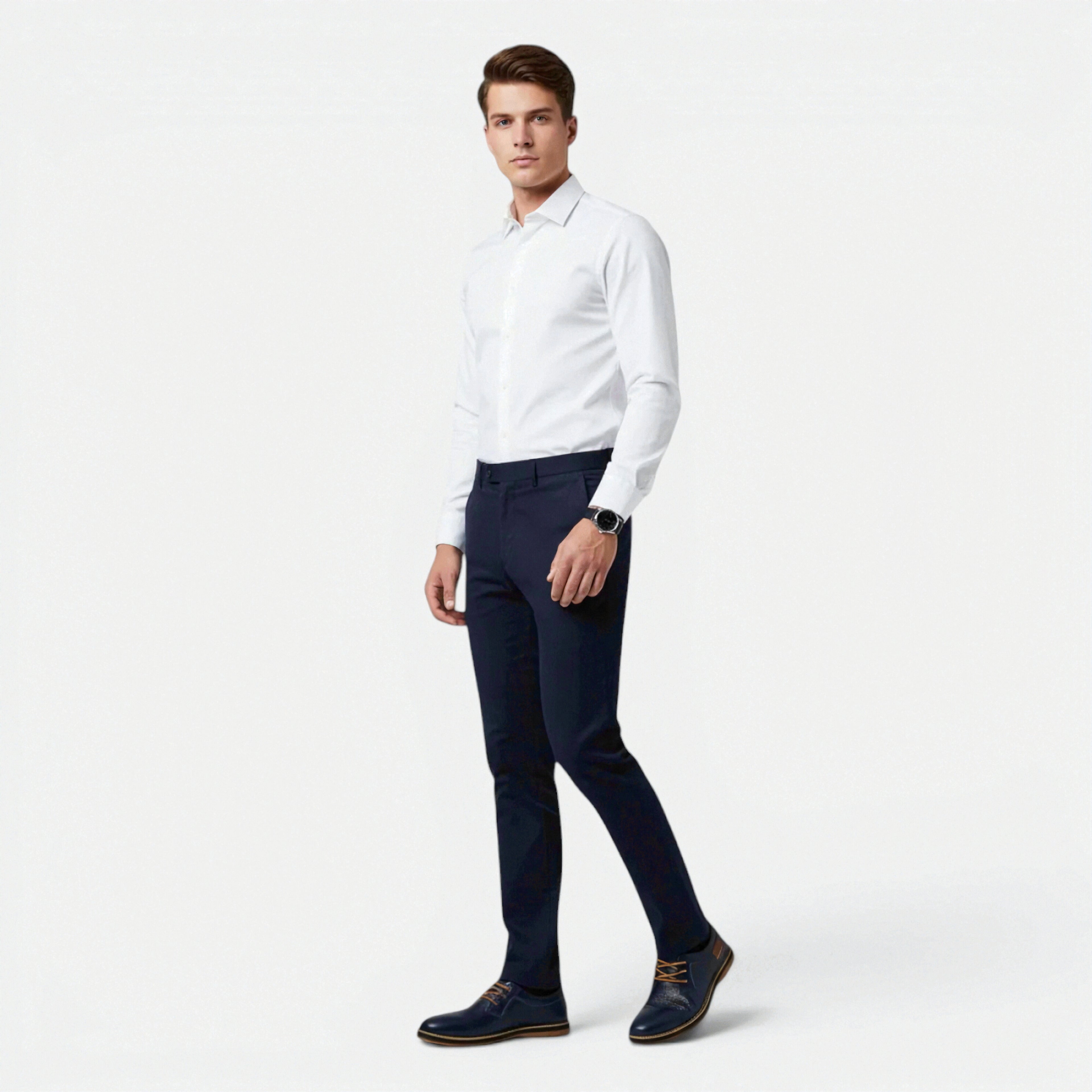 Man wearing a white dress shirt and navy pants on a white background