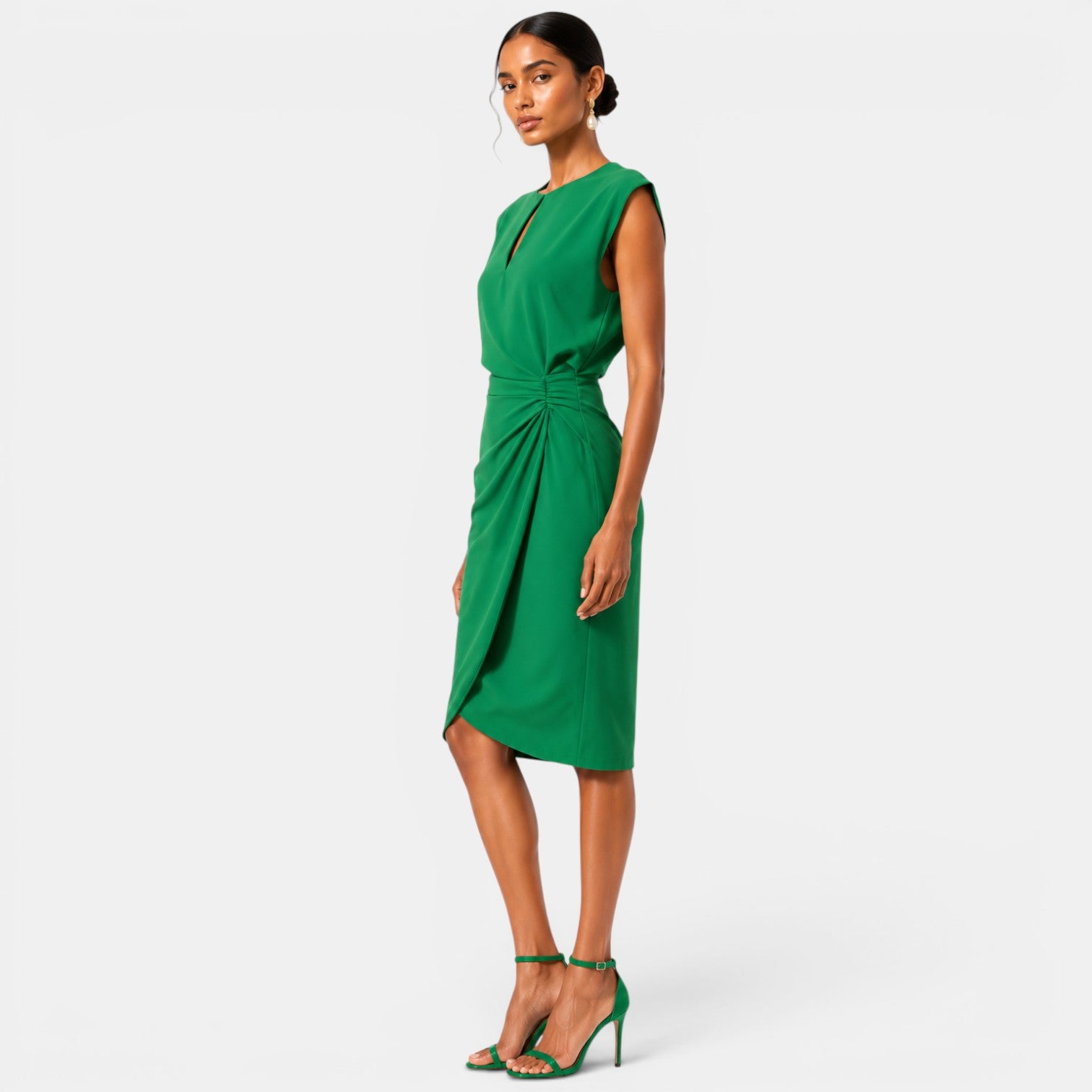 Woman wearing a green dress on a white background
