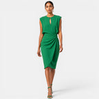 Woman wearing a green dress on a white background