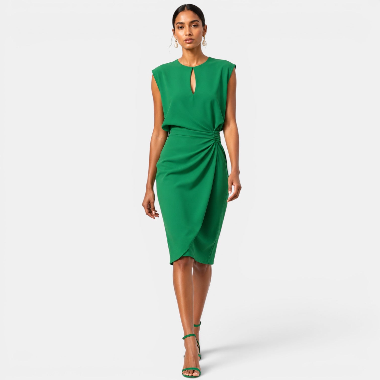 Woman wearing a green dress on a white background