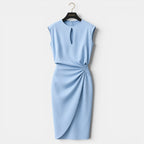 Light blue dress on a hanger against a white background