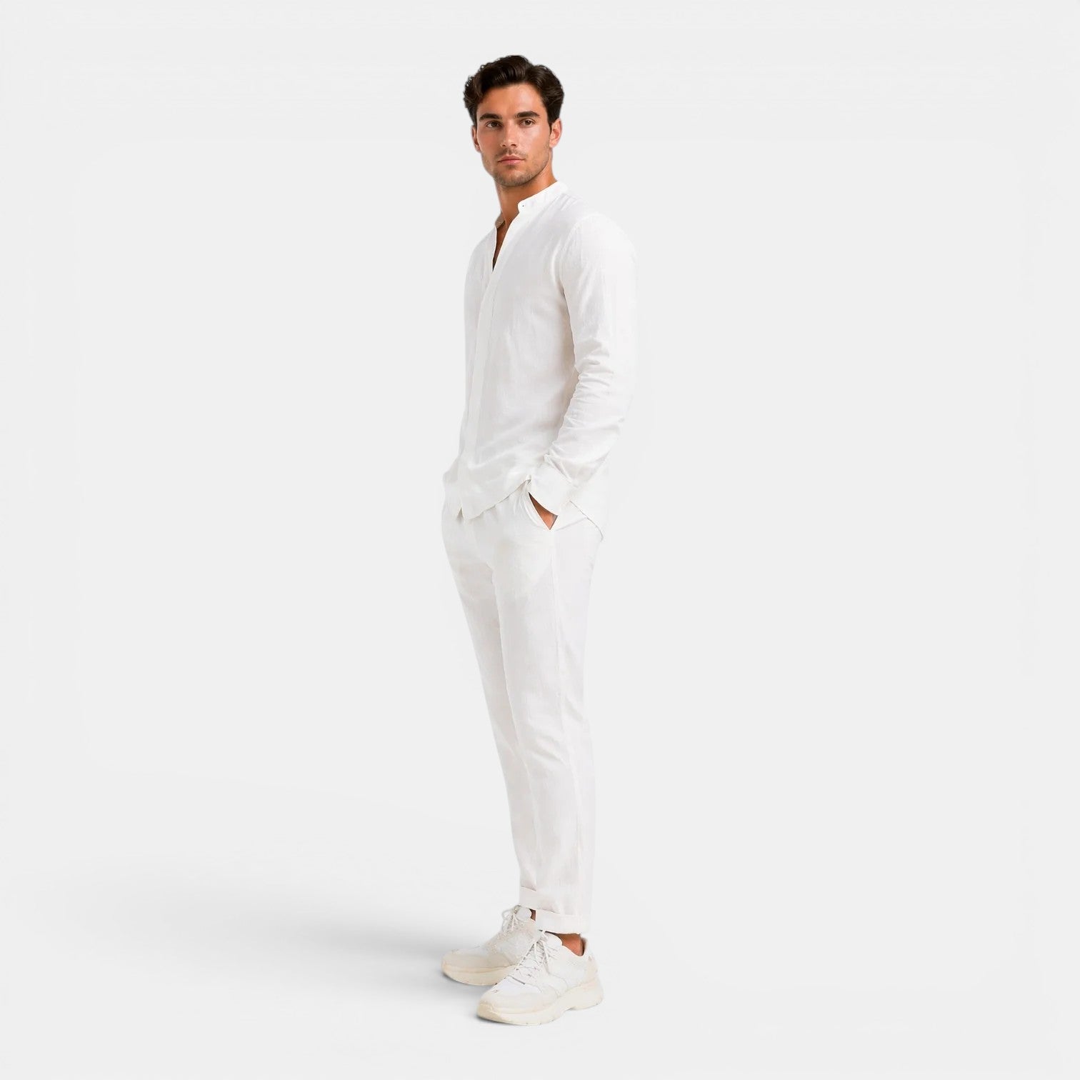 Man wearing a white onesie on a light gray background