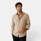 Man wearing a beige shirt on a white background