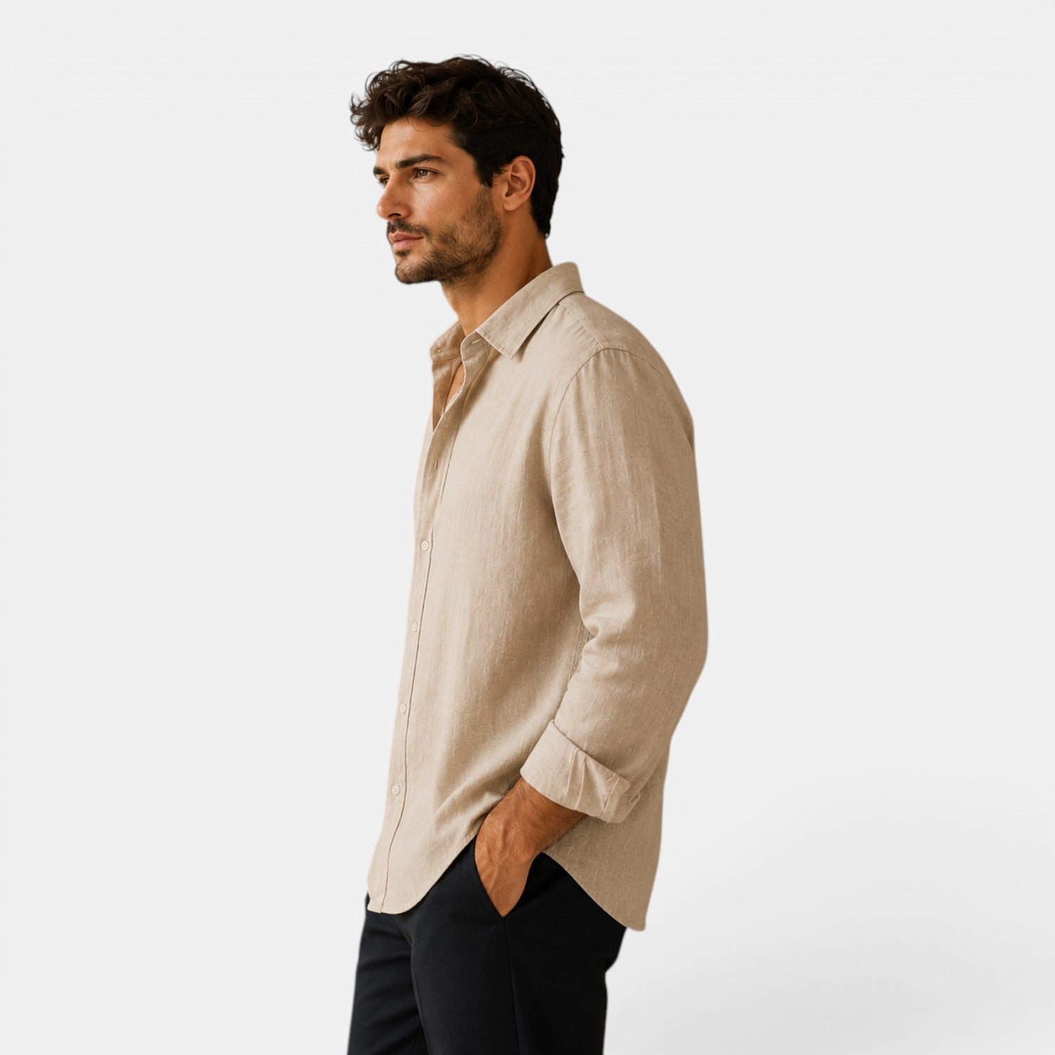 Man wearing a beige shirt against a white background