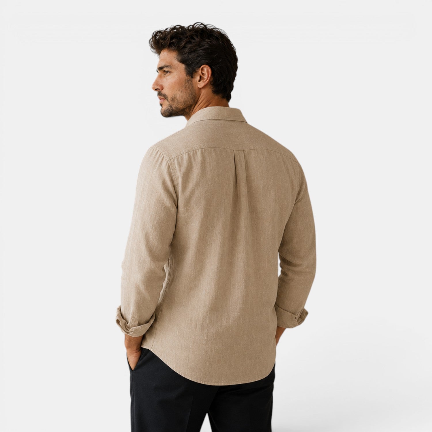 Man wearing a beige shirt on a white background