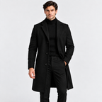 Men's black long overcoat styled with a black turtleneck and trousers