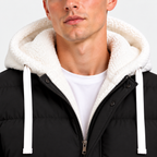 Close-up of men's black puffer jacket with white hood and front zipper
