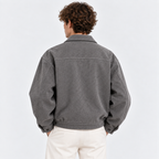 Back view of a men's gray jacket with a simple design and relaxed fit
