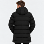 Back view of a man wearing a black hooded quilted puffer jacket