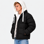 Side view of a man wearing a black puffer jacket with white hood and drawstrings