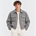 Men's gray zip-up jacket with pointed collar, flap chest pockets, and relaxed fit