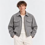 Men's gray zip-up jacket with pointed collar, flap chest pockets, and relaxed fit
