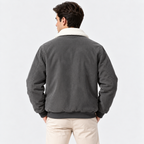 Back view of a man wearing a gray shearling collar jacket