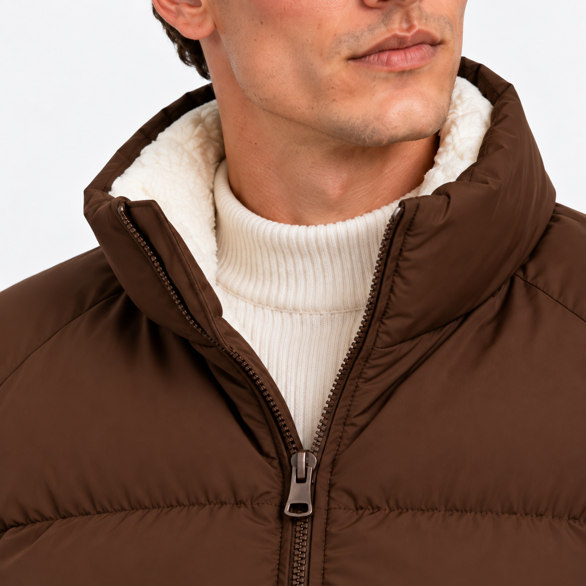Close-up of men's brown puffer jacket with stand collar and front zipper