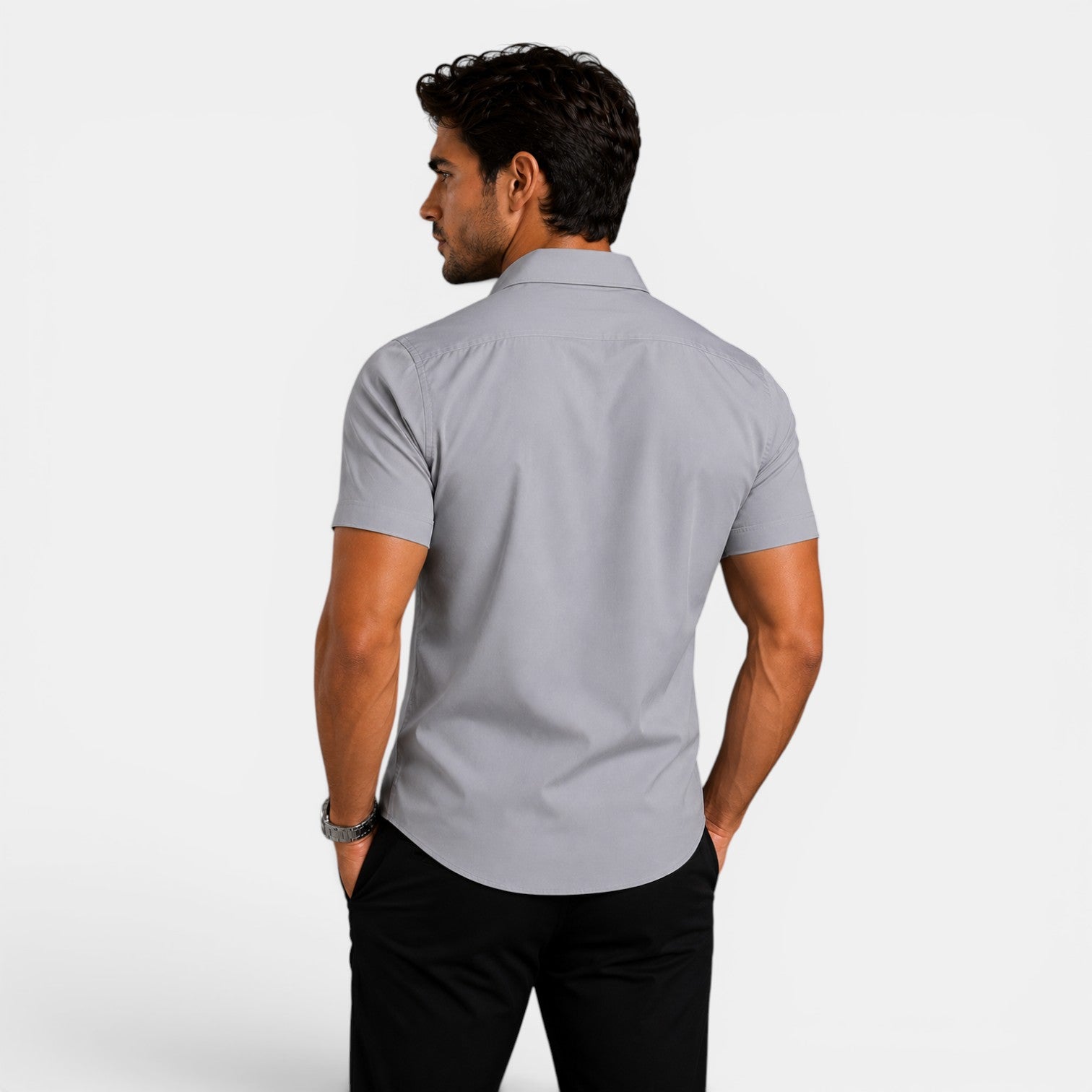 Man wearing a gray short-sleeve shirt on a white background